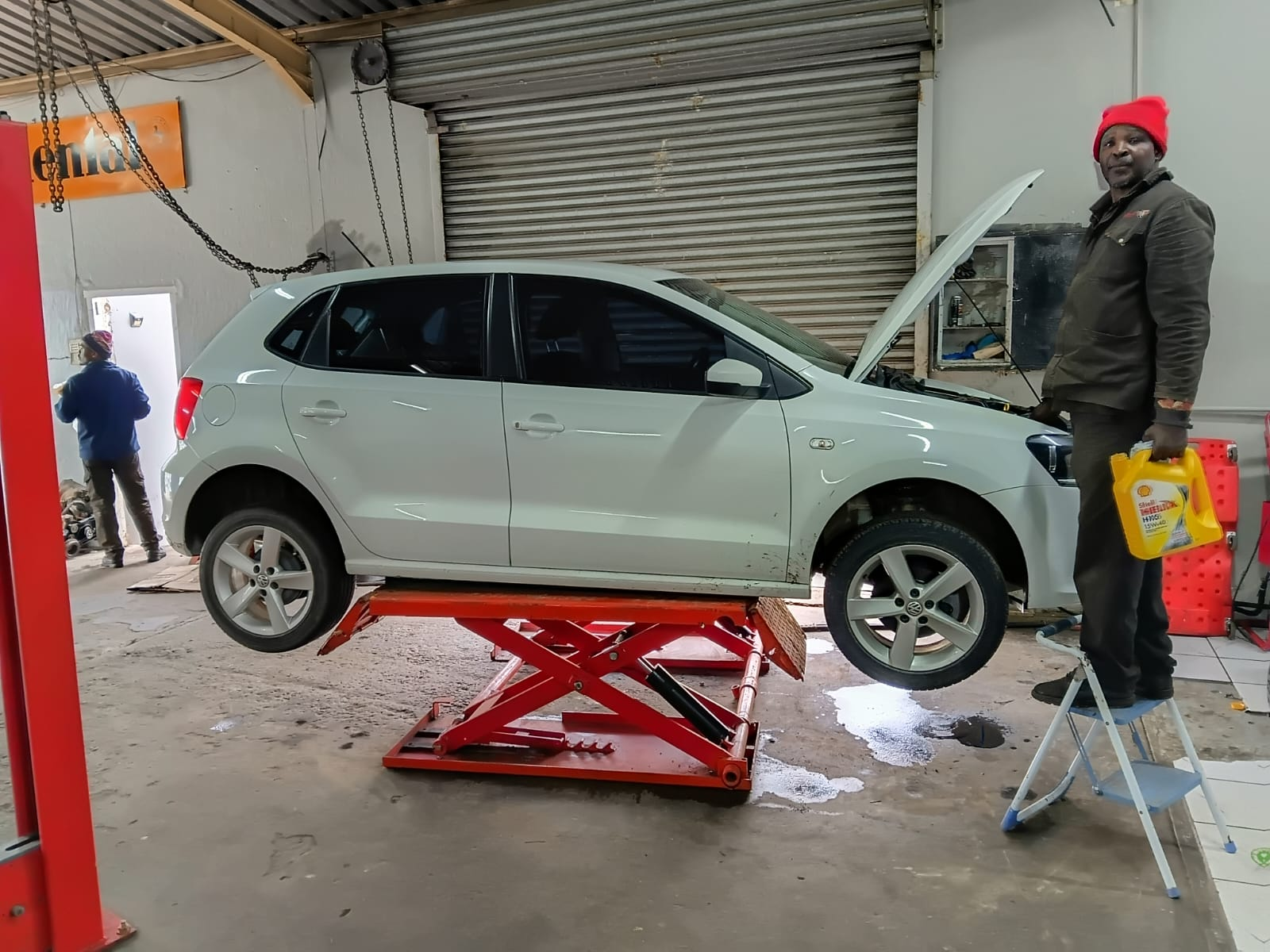 Vehicle on scissor lift for minor service and oil change